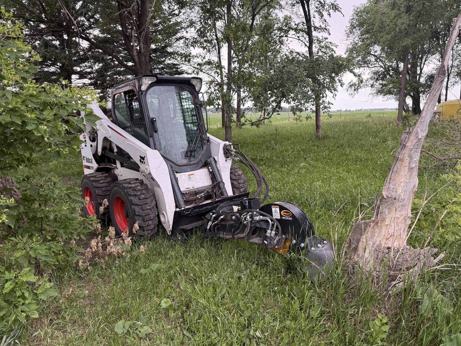 Bobcat stump grinder working in southwest Minnesota